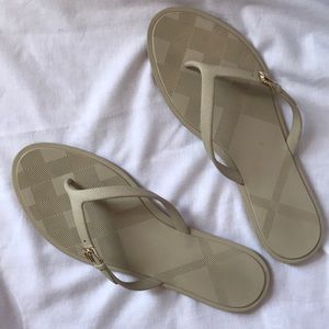 Burberry tan flip flop sandals with gold buckle